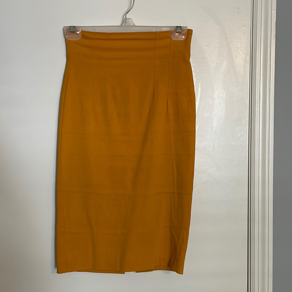 Mustard yellow zippered midi skirt.